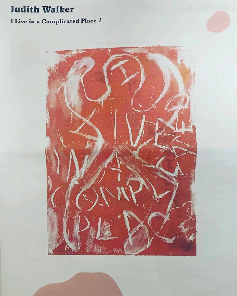 mono print of a man body in red with the words I live in a complicated Place My Body in white